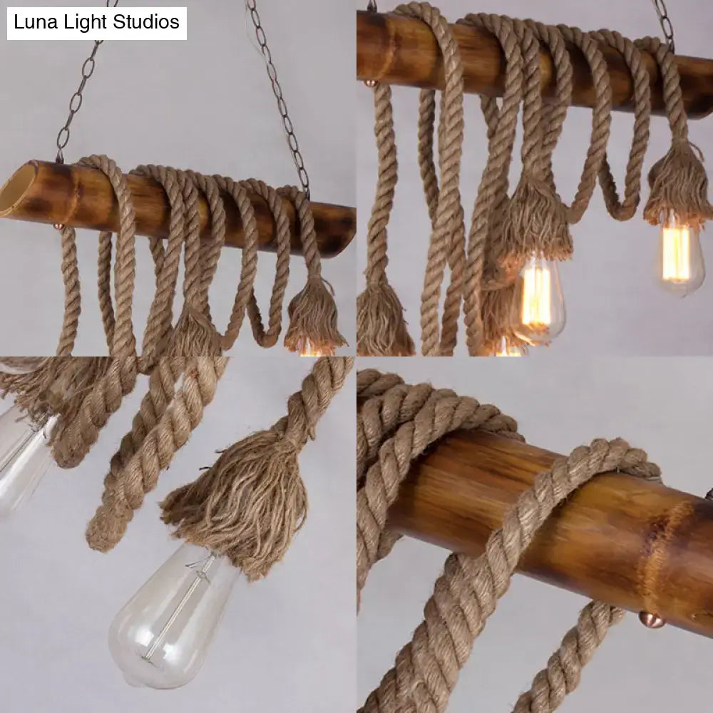 Rustic nautical-style decorbites™ adjustable rope island light with beige bamboo pole and thick rope holding edison bulbs
