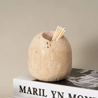 Beige travertine match holder with rustic textured stone surface for living room decor by decorbites