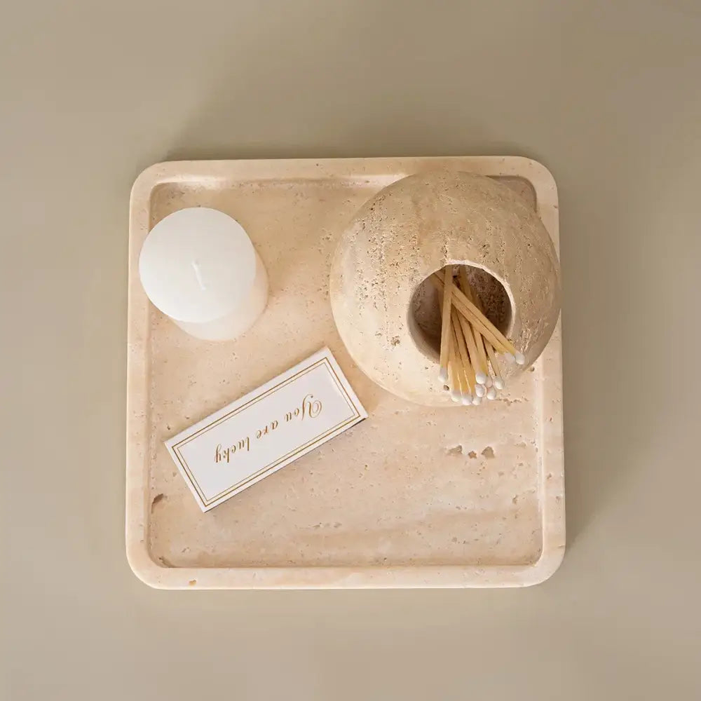 Rustic beige travertine match holder stone tray with smooth textured surface and rounded corners for living room decor