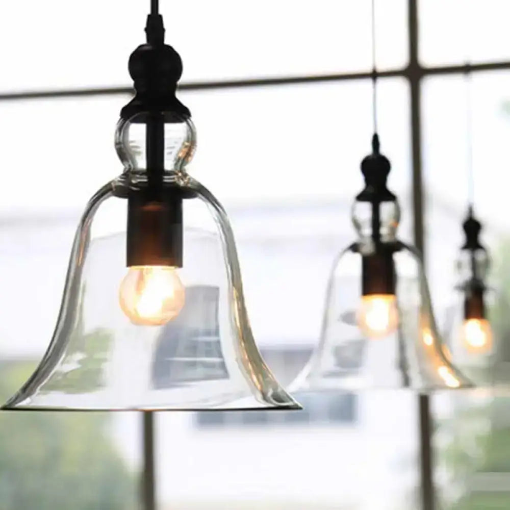 DecorBites black single ceiling pendant lamp with clear glass bell shade and exposed bulb in a rustic design