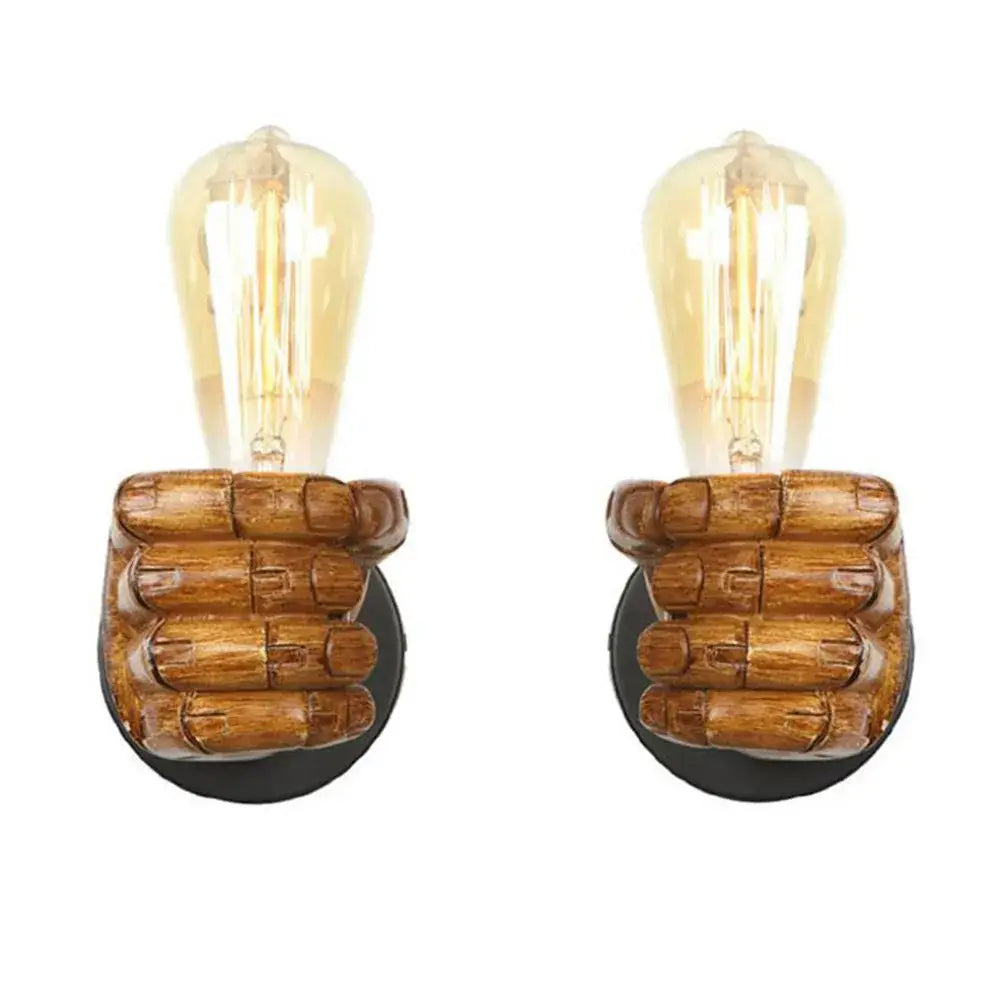 Pair of rustic black and coffee wooden fist-shaped wall light pair with amber filament bulbs for bedroom decor