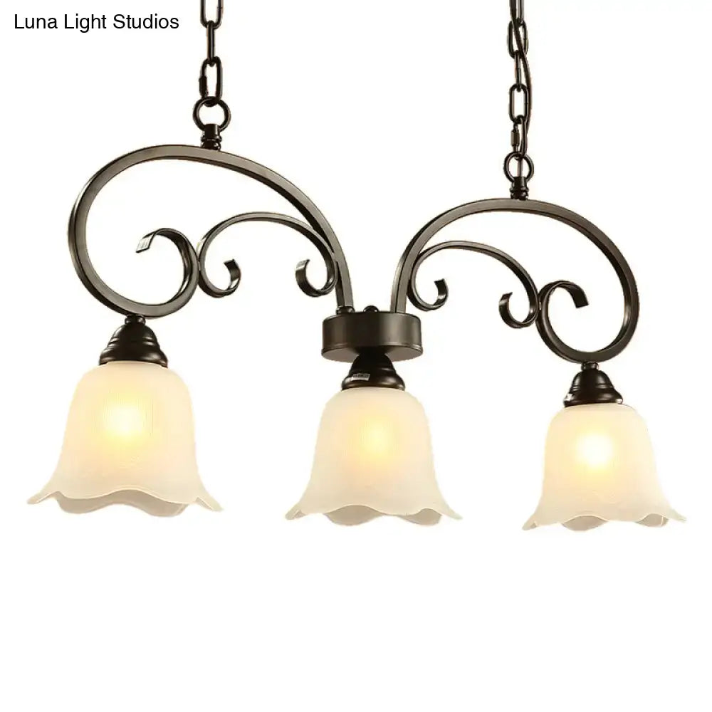 Black wrought iron DecorBites rustic pendant island lamp with black floral swirls and frosted white glass shades for restaurants