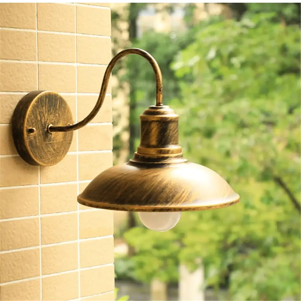 Antique brass light fixture with curved arm and domed shade, ideal as decorbites black rustic gooseneck wall sconce