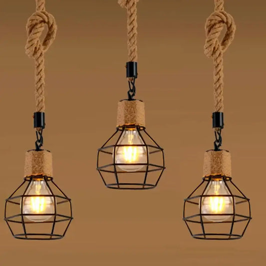 Rustic black iron pendant light with three hemp rope suspensions and black metal cages for dining room use