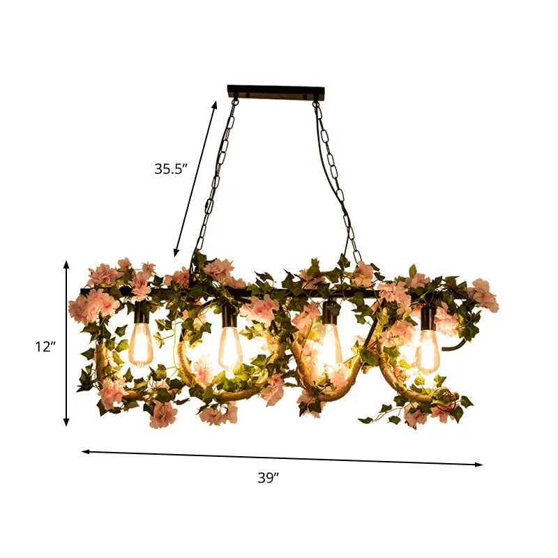 DecorBites black metal linear island lamp with five exposed bulbs and hanging artificial pink flowers and green vines
