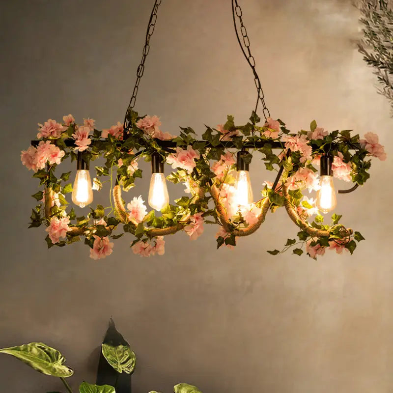 DecorBites™ black metal 4-light linear island lamp with wrought iron chandelier, exposed bulbs, and pink artificial vines