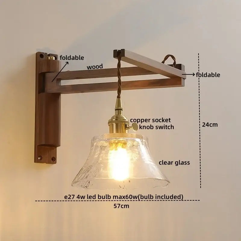 Rustic brass wall sconce with clear glass shade and wooden foldable bracket featuring decorbites clear glass design