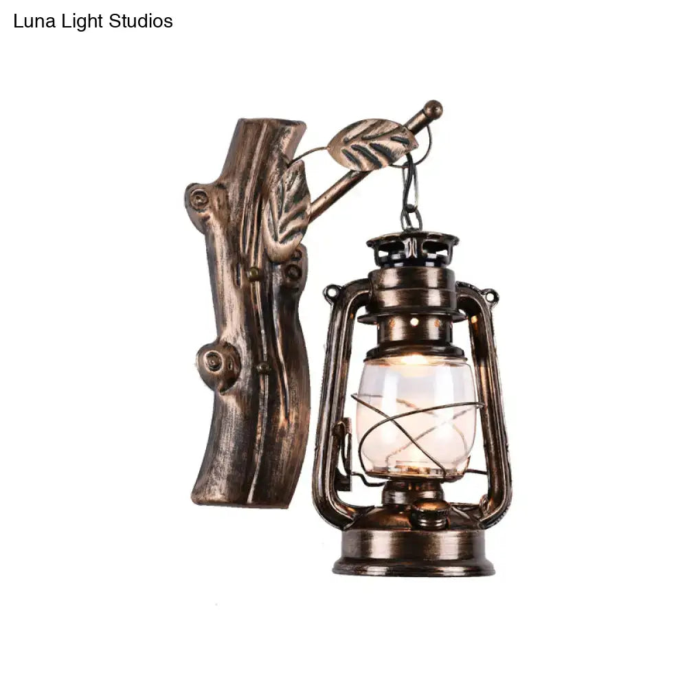 Antique bronze-finished oil lantern wall sconce with tree-trunk bracket and leaf accents for corridor lighting