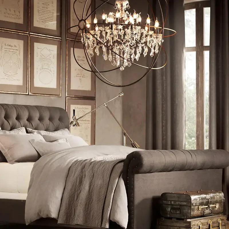 Rustic bronze crystal earth birdcage chandelier with dark metal frame hangs above bed for decorbites crystal earth decor