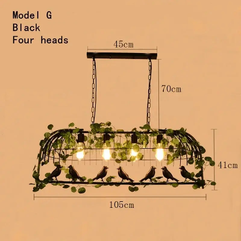 Black metal bird cage chandelier with four exposed bulbs adorned with green leaf bird ivy for dining room light