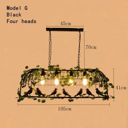 Black metal bird cage chandelier with four exposed bulbs adorned with green leaf bird ivy for dining room light