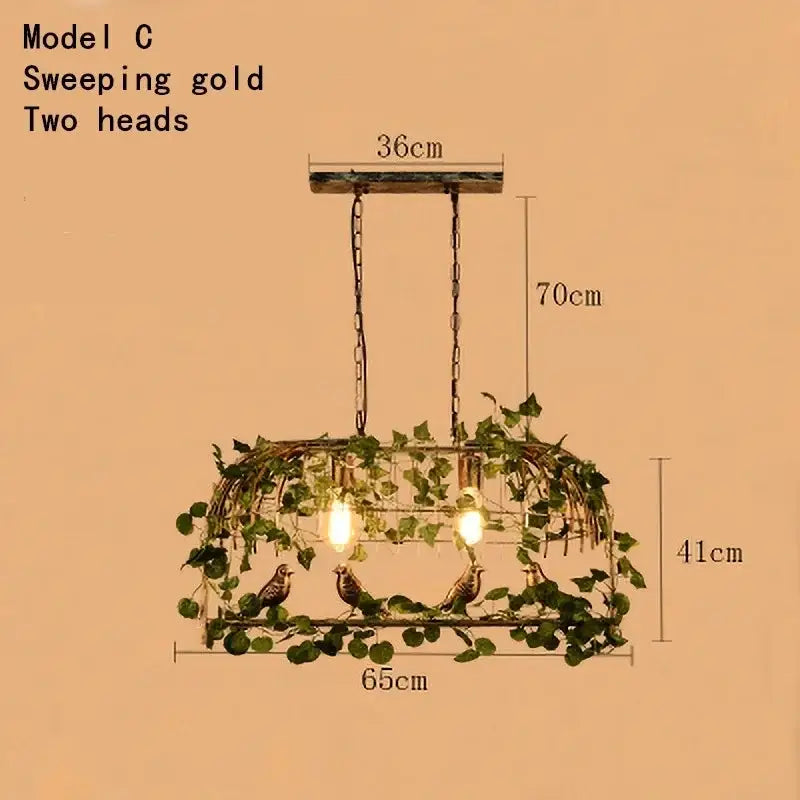 Rustic bronze green leaf bird cage chandelier with sweeping gold two-head pendant light and artificial vines and birds