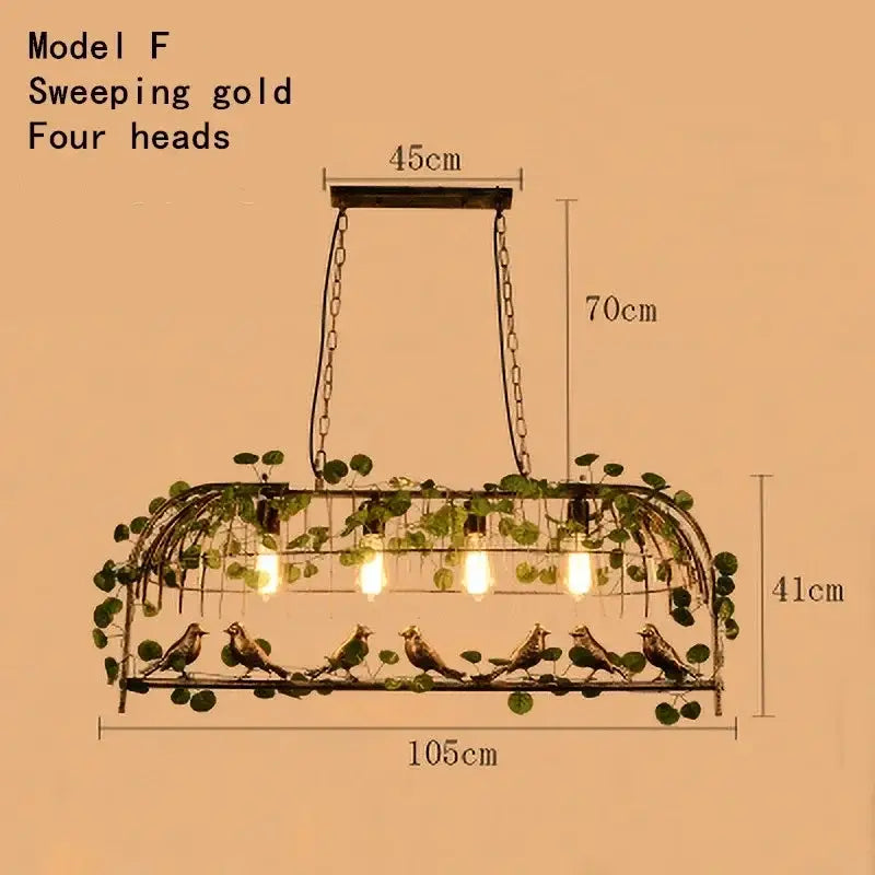 Rustic bronze leaf bird cage chandelier with sweeping gold four-head pendant light and ornate bird vine design