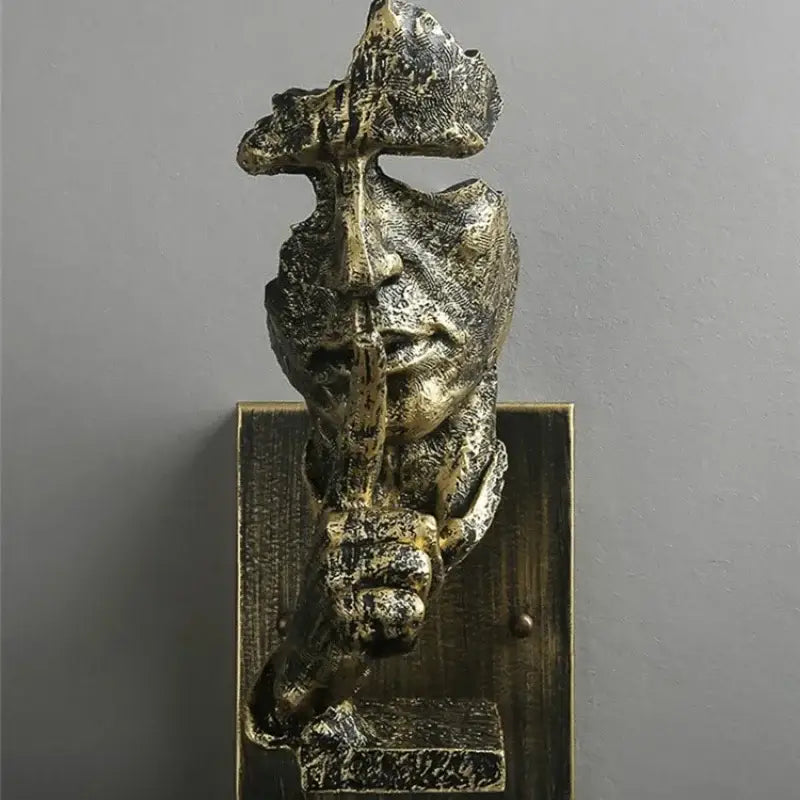 Antique bronze sculptural wall lamp with rustic loft face featuring textured weathered surface and intricate detailing