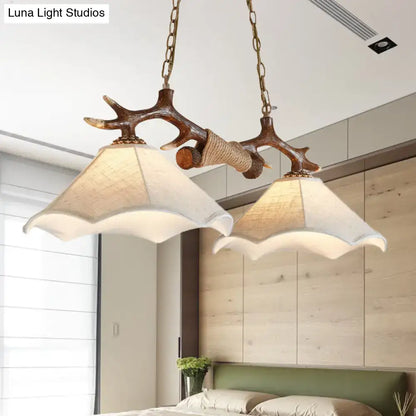 DecorBites traditional bell ceiling light with antler arm and two cream scalloped flaxen fabric bulb shades suspended by brass chains