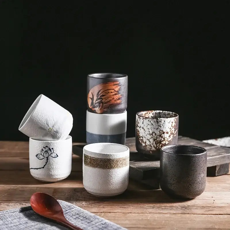 Handcrafted coarse ceramic tea cups in earthy tones with floral motifs and rustic glazes for dining room decorbites coarse ceramic set