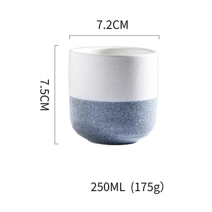 A rustic coarse ceramic tea cup with a two-tone smooth white and speckled blue design perfect for decorbites coarse ceramic sets