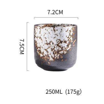 Rustic coarse ceramic tea cup with speckled black white glaze and golden flecks hand painted for dining room decorbites