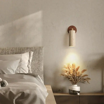 Rustic concrete and dark wood led wall sconce with a textured off-white cylindrical body and copper backplate decorbites led wall