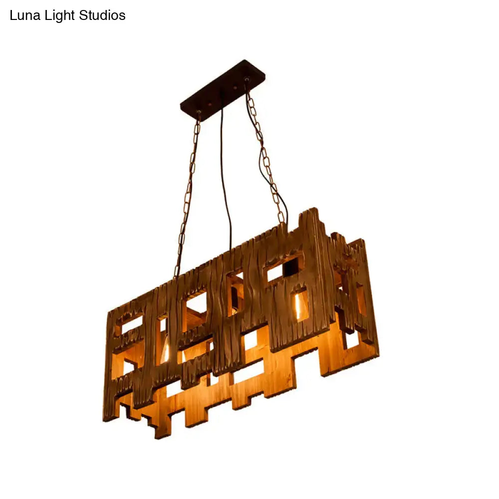 Rustic copper rectangular wooden restaurant island chandelier with warm amber glow and intricate cut-out patterns