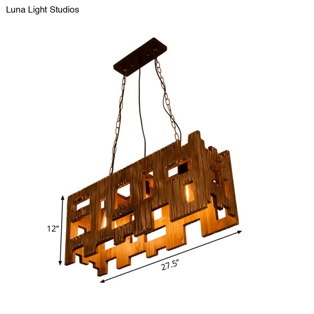 Rustic copper rectangular wooden restaurant island chandelier with warm amber glow and intricate cut-out patterns