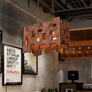 Rustic copper rectangular restaurant island chandelier with textured cut-out patterns and warm internal lighting