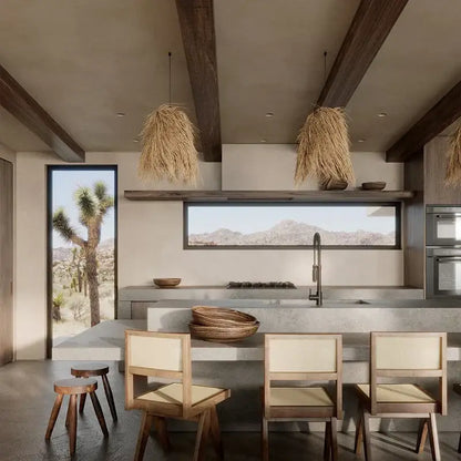 Rustic dark wood handwoven rattan led pendant light in a modern kitchen with concrete countertops and exposed beams