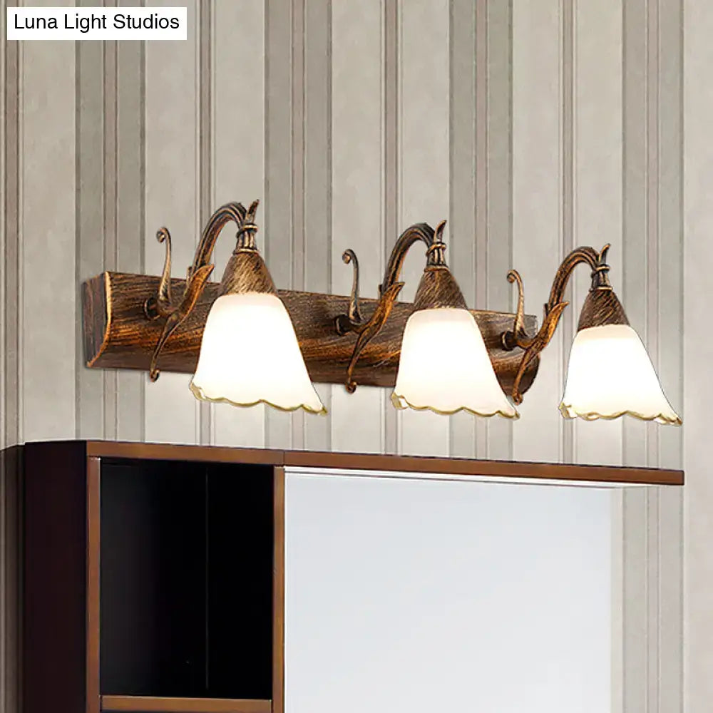 Antique bronze-finished wall light with three frosted distressed white glass shades and rustic wooden base 110v-120v