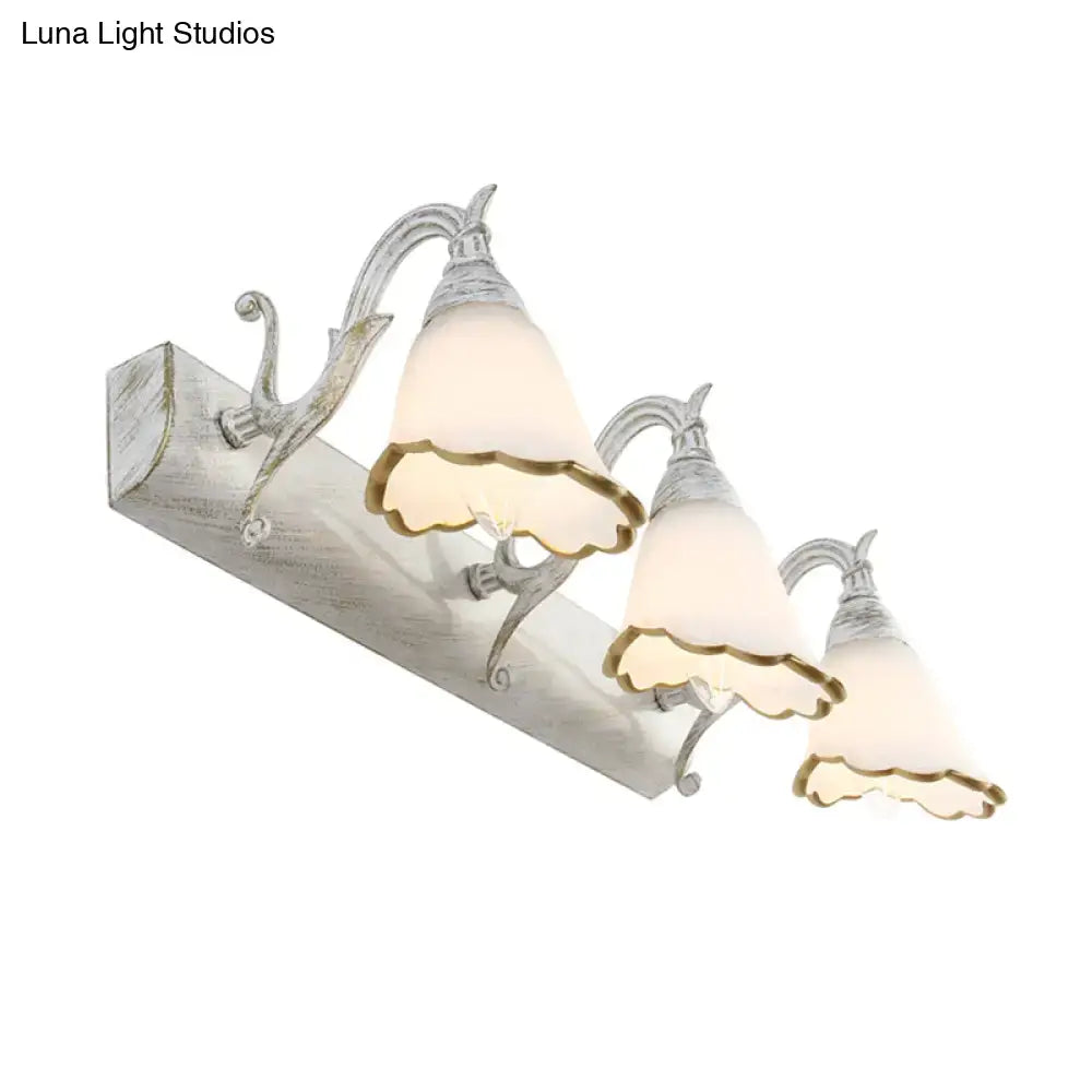 Antique distressed white metal wall light with three frosted glass shades and gold trim for 110v-120v use