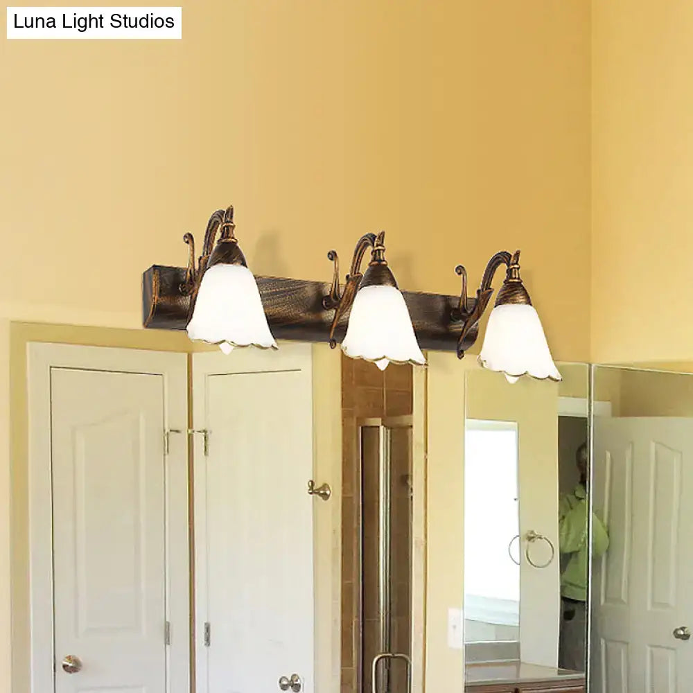 Antique bronze-finished three-light wall light with frosted bell-shaped shades and distressed white glass for 110v-120v use