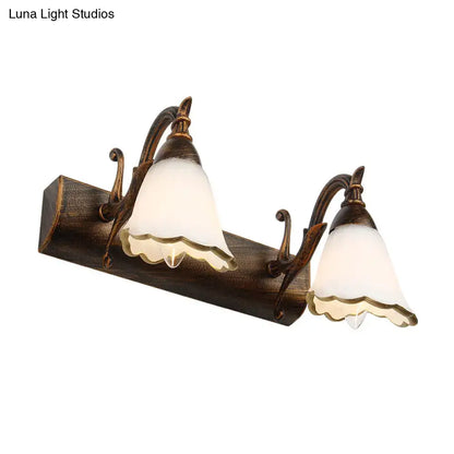 Antique bronze finished wall light with two frosted glass bell shades in rustic distressed white 110v-120v design