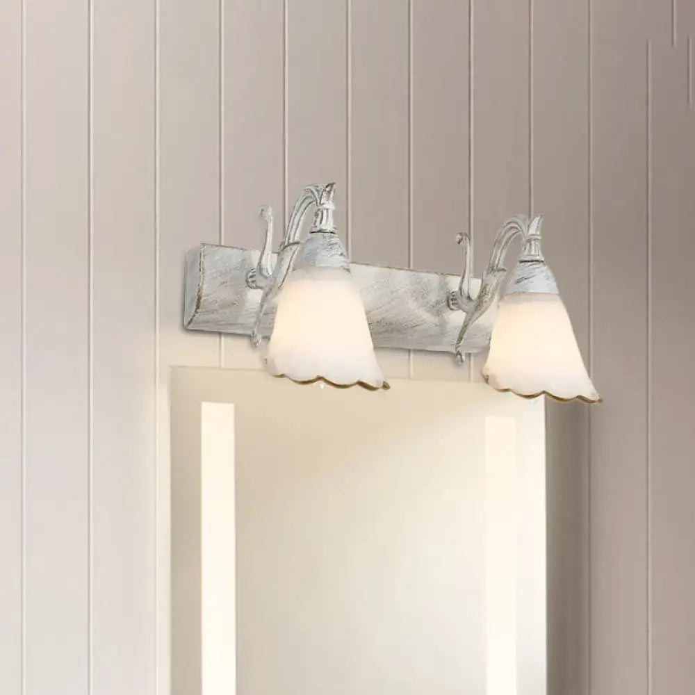 Vintage-style wall light with two frosted glass shades and distressed white metal frame for 110v-120v use