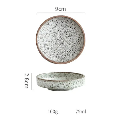 A 9cm ceramic round sauce dish with speckled gray white glaze and brown rim from decorbites ceramic round set