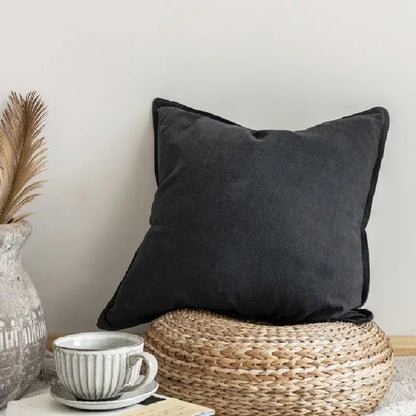 Black linen fringed pillow cover with subtle texture and neatly stitched edges for rustic earthy tones decorbites decor