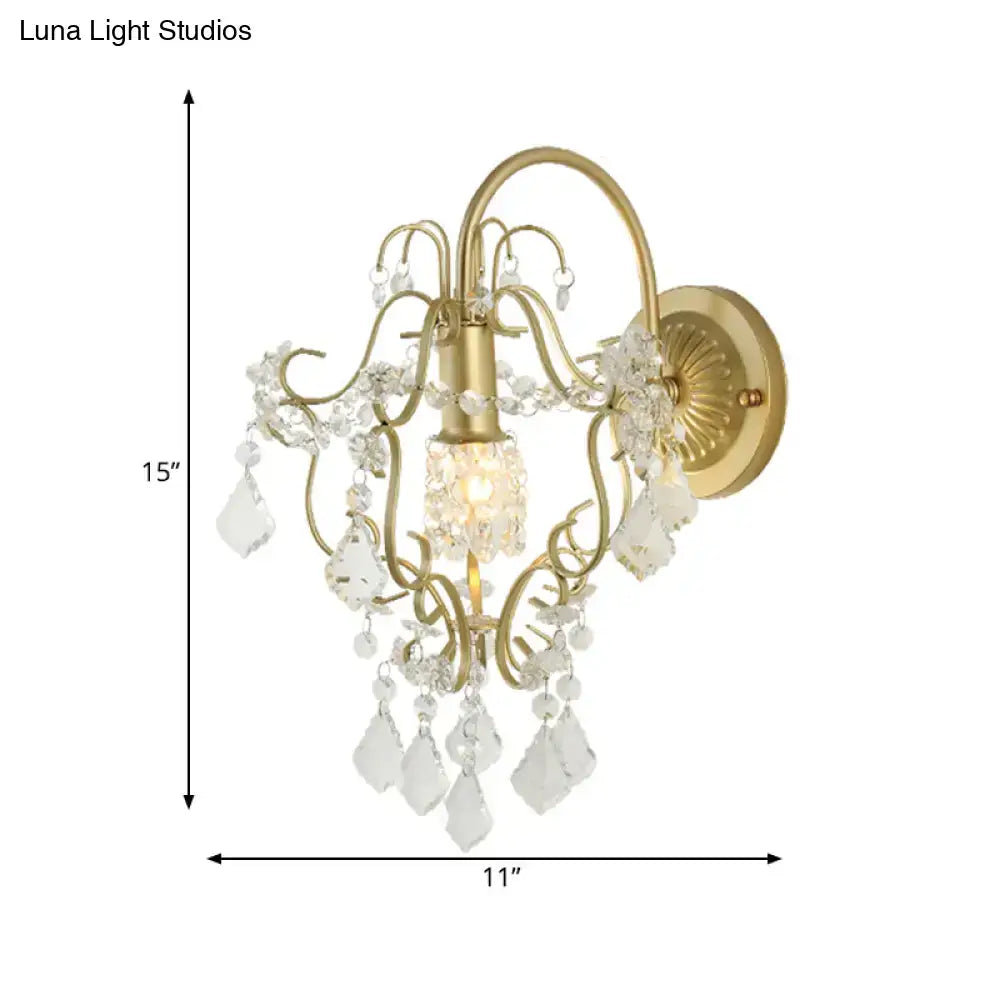 Rustic gold crystal wall mount lamp with ornate metalwork and dangling clear crystal droplets for elegant lighting