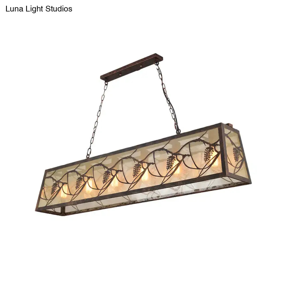 Rectangular rustic grapevine island light fixture with dark bronze metal frame and amber stained glass panels
