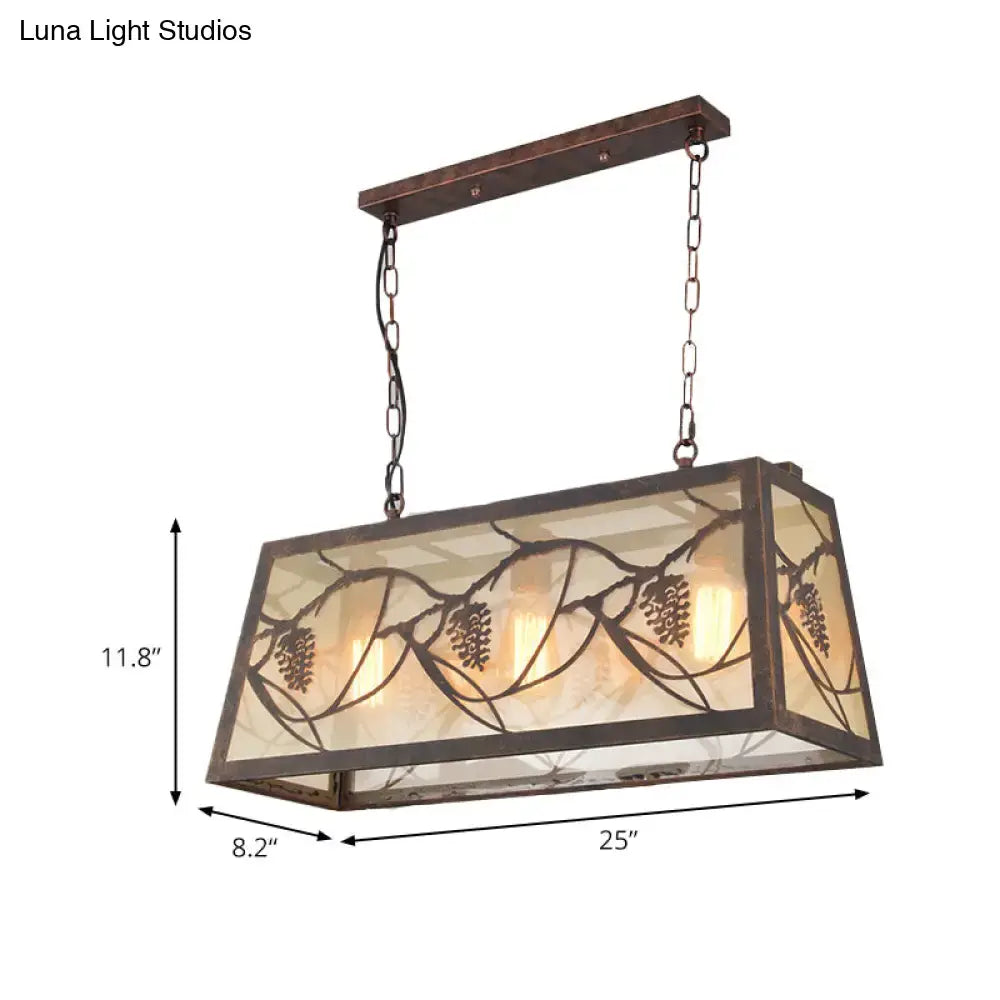 Rustic grapevine rectangular island light fixture with dark bronze metal frame and etched pinecone glass panels