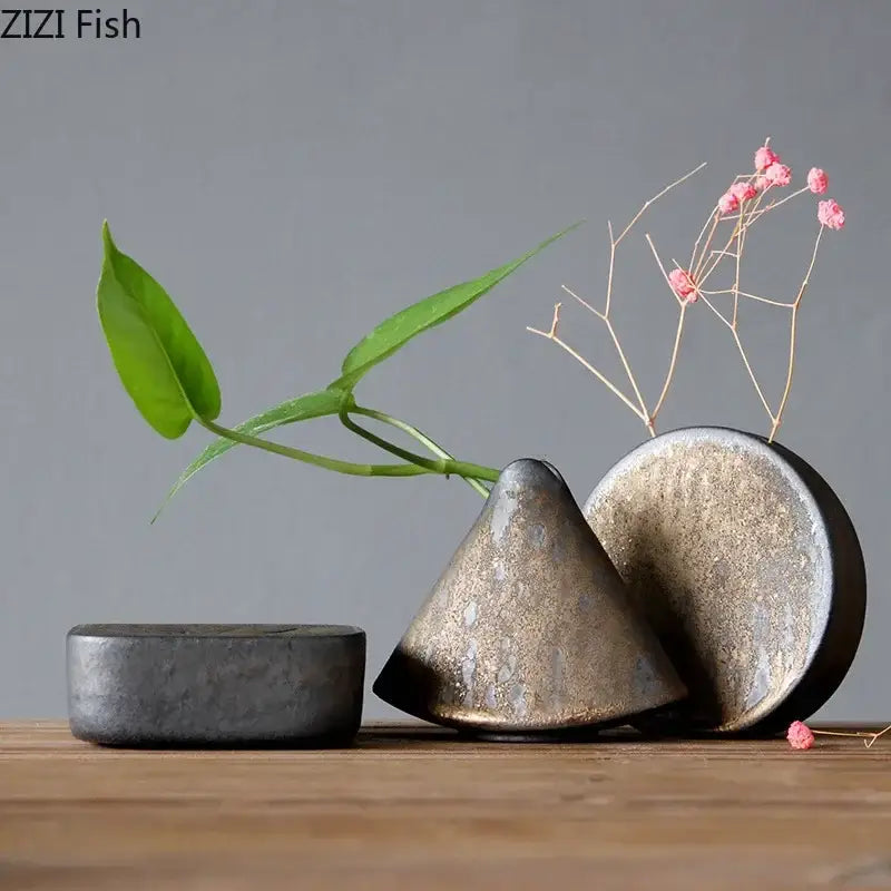 Matte gold and black coarse pottery vase small with conical shape holding pink flowers for living room decorbites decor