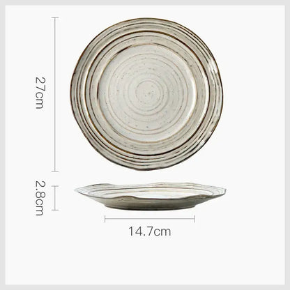 Rustic grayish white ceramic dish bowl set featuring concentric ridges and a speckled glaze with raised rim
