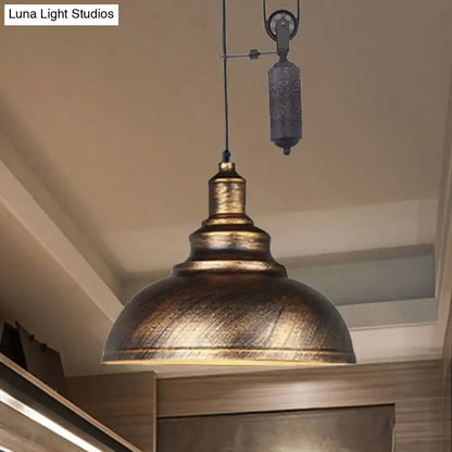 Antique brass-finished rustic industrial dome pendant lamp with pull-chain and textured metal shade for living room lighting
