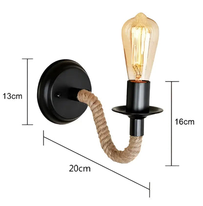 Black metal wall lamp with twisted hemp rope arm and exposed filament bulb for rustic industrial bedroom decorbites hemp rope