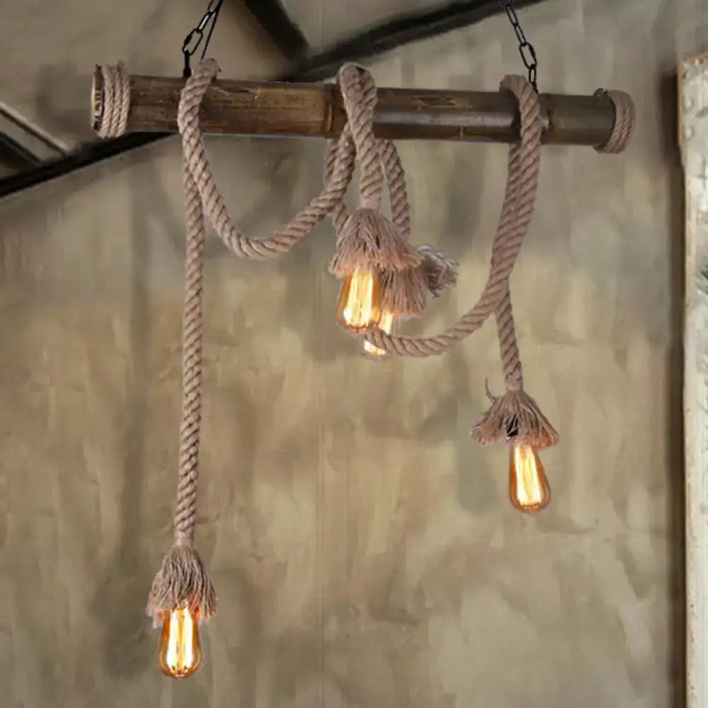 DecorBites™ beige rustic rope pendant light with three exposed Edison bulbs hanging from wooden beam for island use