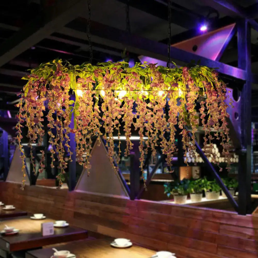 Rustic iron rose pendant light fixture with chain cord length featuring cascading pink and green wisteria flowers
