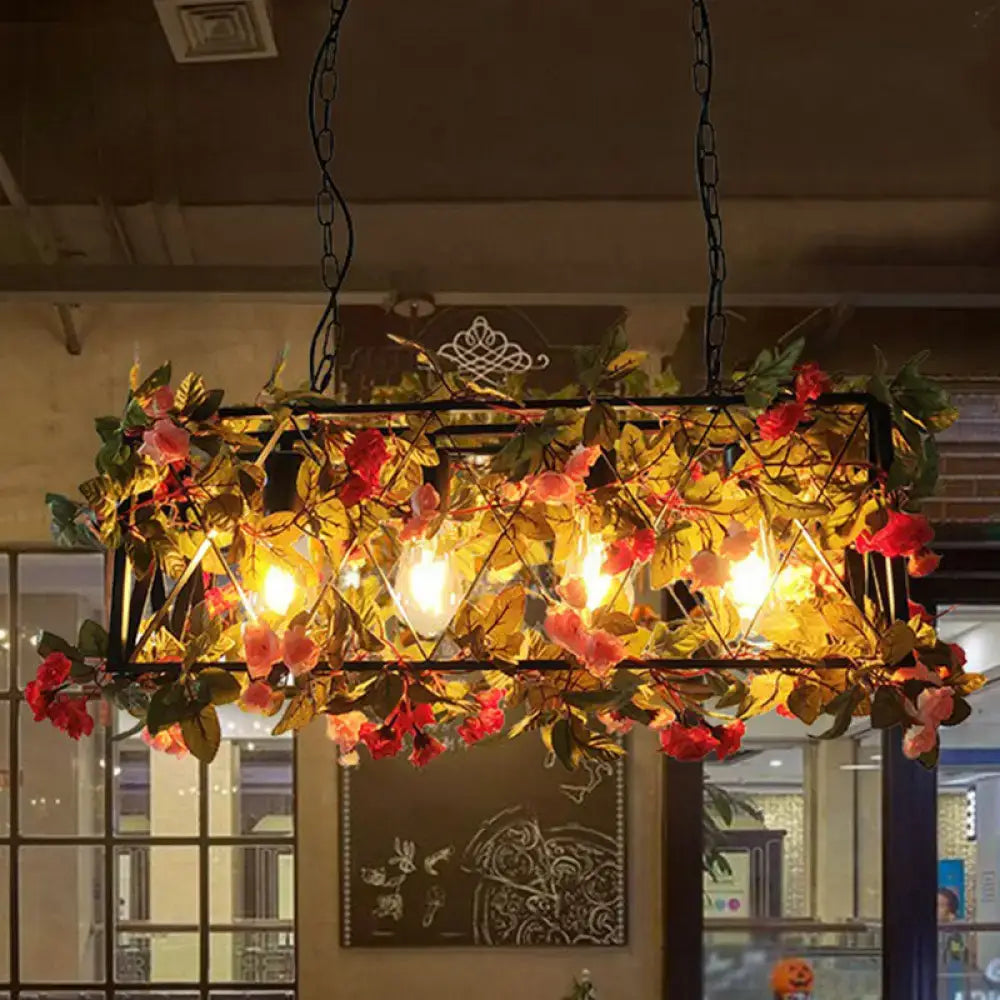 Rustic iron rose pendant light fixture with black metal frame, pink and red flowers, warm bulbs, and adjustable chain cord length
