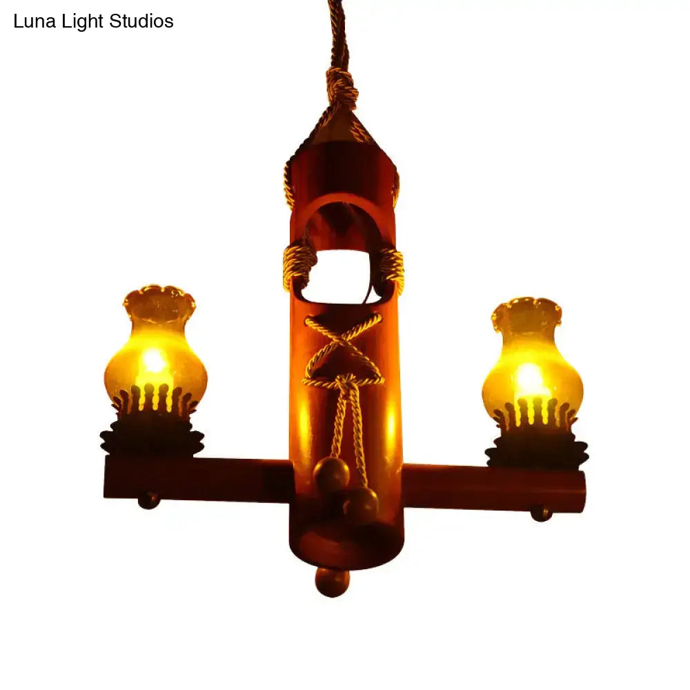 Rustic wooden pendant light with two amber glass lanterns and rope detailing for retro black yellow kerosene island light