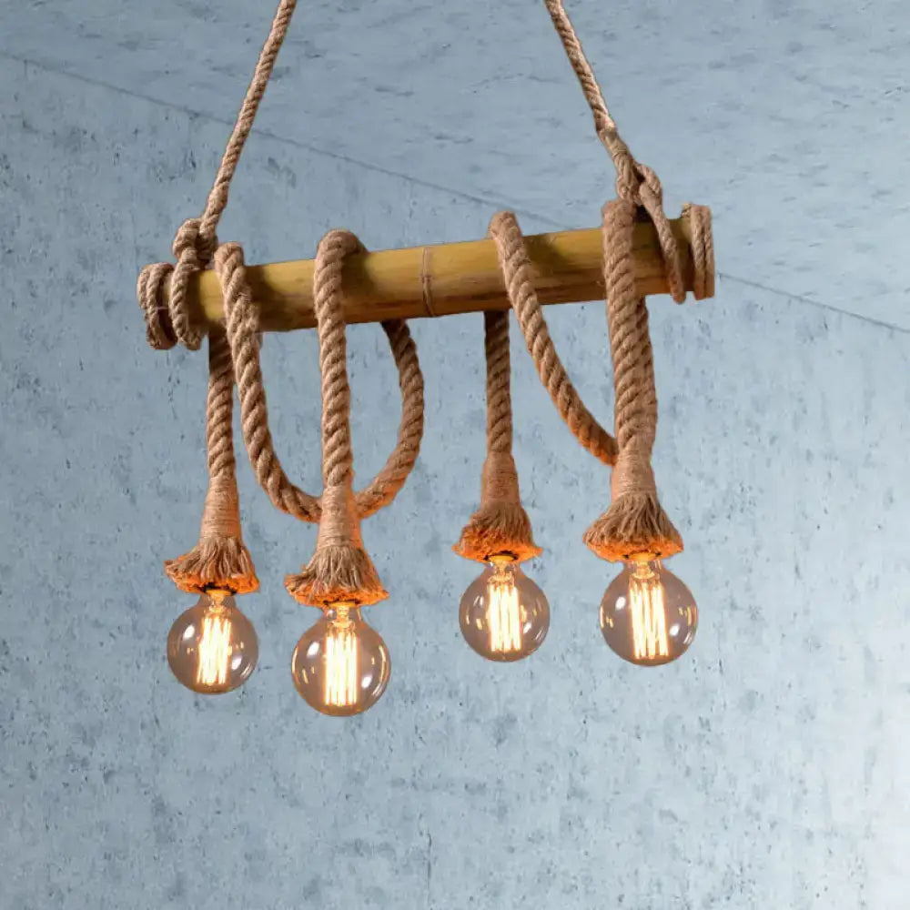 Rustic bamboo island light with thick beige rope and four glowing filament bulbs from decorbites lodge industrial series