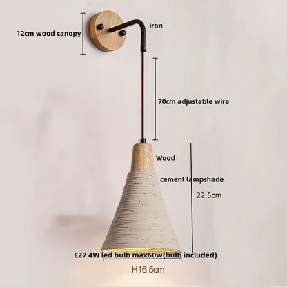 Rustic moon cement led wall lamp with a natural wood base, black iron arm, and off-white textured cement shade decorbites cement led