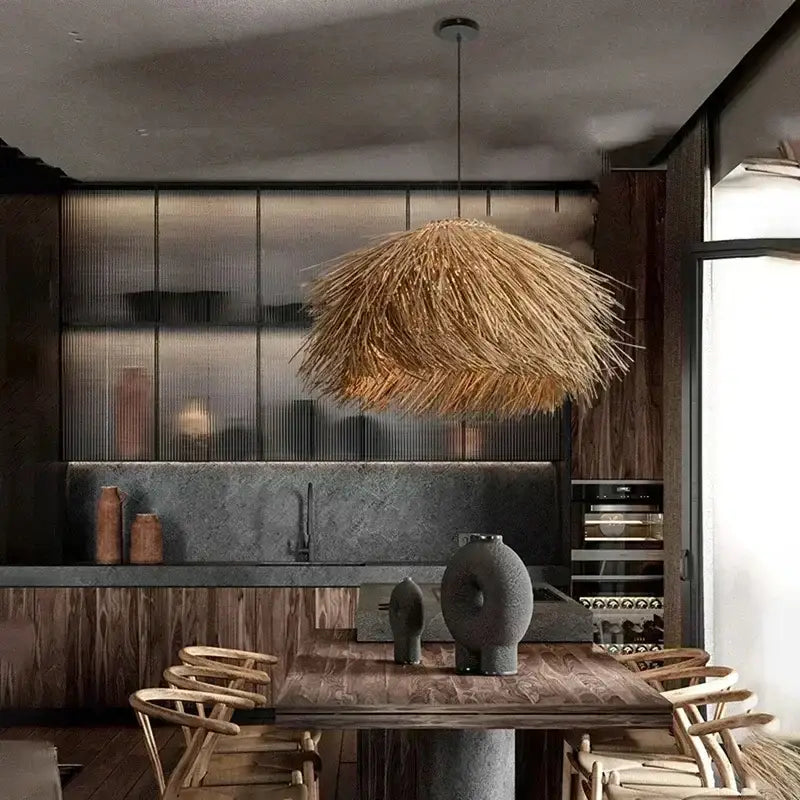 Rustic pendant light with golden-brown natural straw shade hanging above dining table to bring warmth