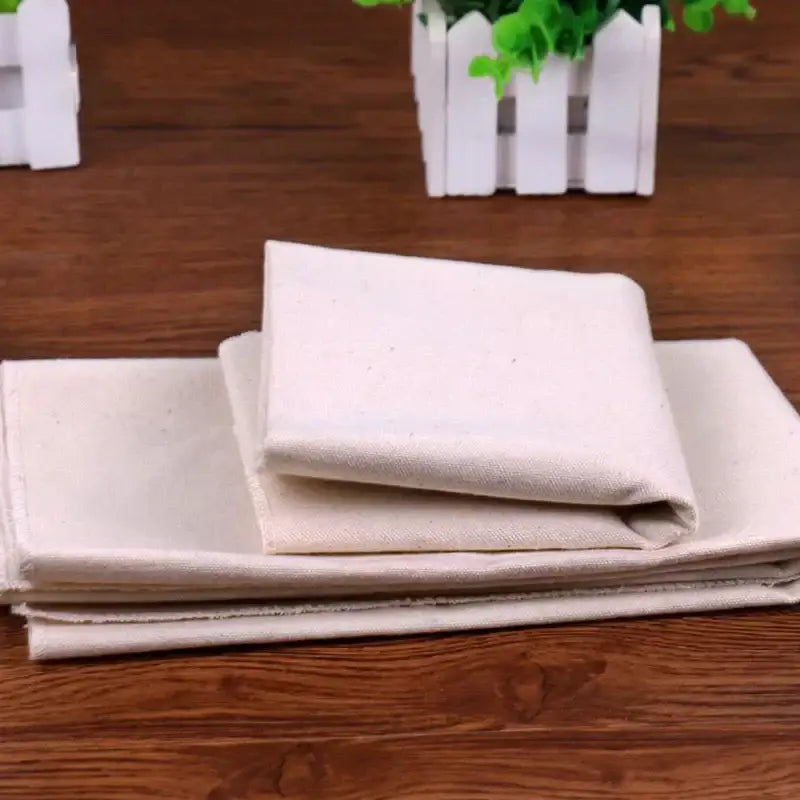 Stack of rustic off-white linen flax cloth panels for baking mat kitchen tool set by decorbites linen flax