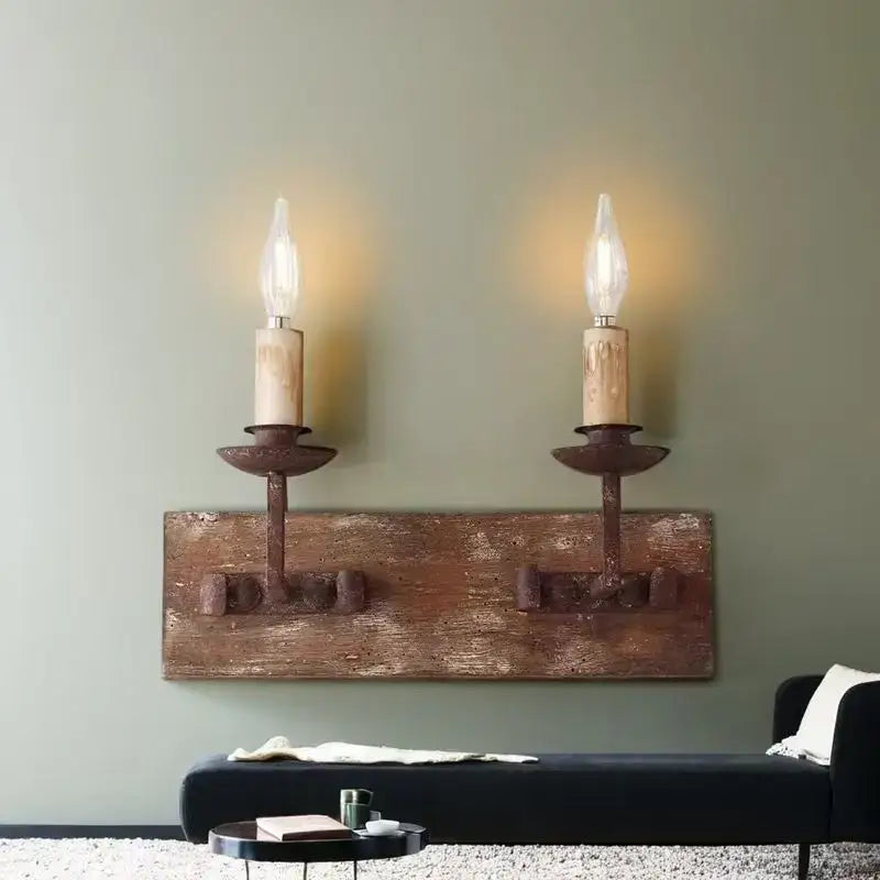 Rustic retro solid wood wall light with two wrought iron candle-style fixtures and exposed filament bulbs for bedroom decorbites country retro
